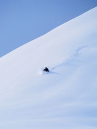 Low angle view of snowcapped mountain against sky