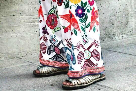 shoe, red, footwear, low section, close-up, wall - building feature, art and craft, day, creativity, street, sidewalk, art, pair, high angle view, graffiti, outdoors, no people, pattern, still life, absence