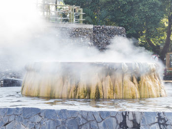 Scenic view of waterfall in park