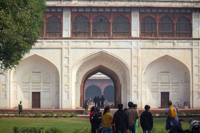 Group of people in front of historical building