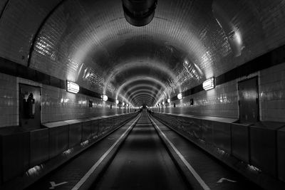 Diminishing perspective of illuminated subway station