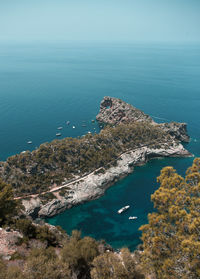 High angle view of rocks by sea