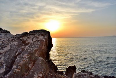 Scenic view of sea against sky at sunset