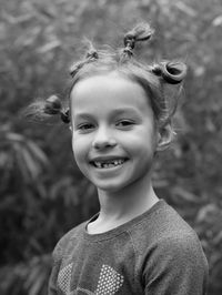 Portrait of cute smiling girl looking at camera