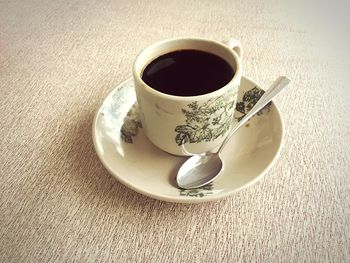 High angle view of coffee cup on table