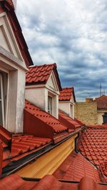 Houses in city against sky