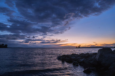 Scenic view of sea against sky during sunset