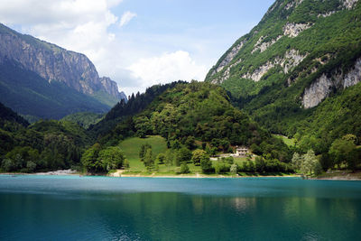 Scenic view of mountains and sea against sky