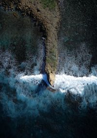 Water splashing on rock