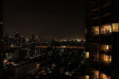 Illuminated buildings in city at night