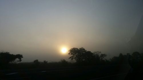 Scenic view of landscape against sky at sunset