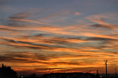 Low angle view of dramatic sky during sunset