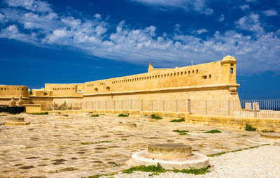 View of historical building against cloudy sky