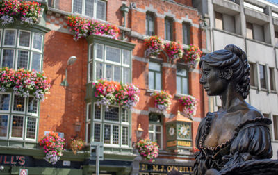 Low angle view of statue against building