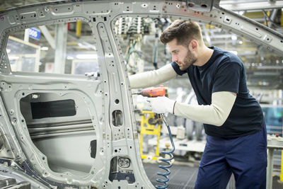 Man working in modern car factory