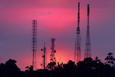 Low angle view of silhouette trees against sky during sunset