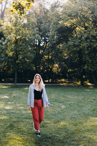 Full length of woman standing in park