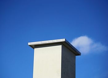 Low angle view of building against blue sky