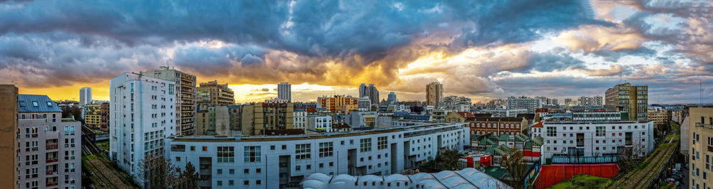 Panoramic view of buildings against sky during sunset