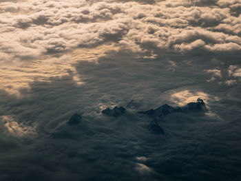 Aerial view of mountains above the clouds.