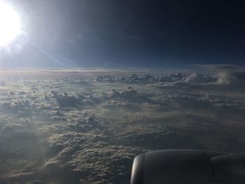 Cropped image of airplane flying over sea