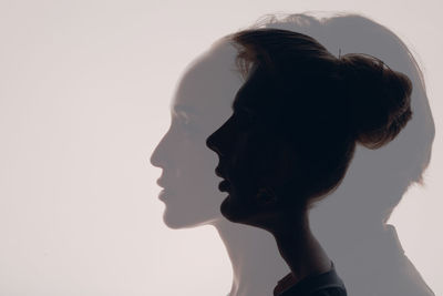 Close-up of young woman against clear sky