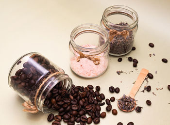 Natural ingredients for beauty product coffee, lavender, salt in glass containers