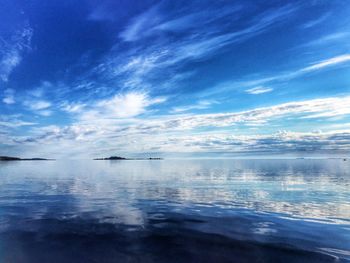 Scenic view of sea against cloudy sky