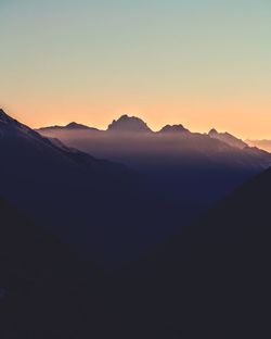 Scenic view of mountains against sky during sunset