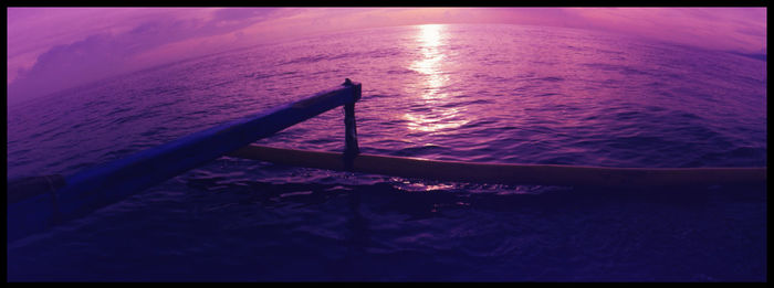 Close-up of sea against sky during sunset