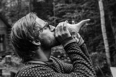 Close-up portrait of man holding umbrella