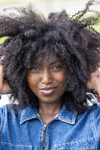 Portrait of young woman with curly hair