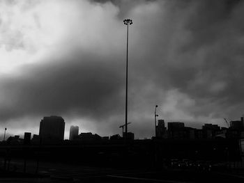 City skyline against cloudy sky