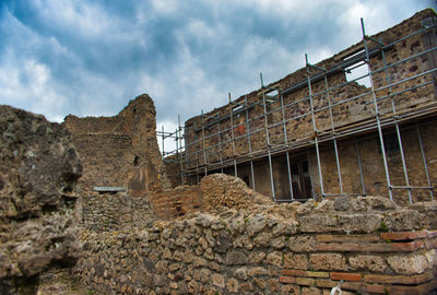 Low angle view of old building against sky