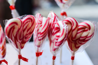 Close-up of heart shape on pink lollipop
