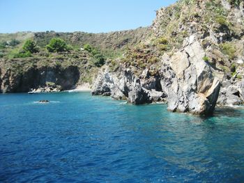 Scenic view of sea against clear blue sky