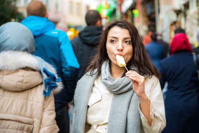 Woman eating ice cream outdoors