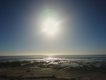 Scenic view of sea against clear sky during sunset