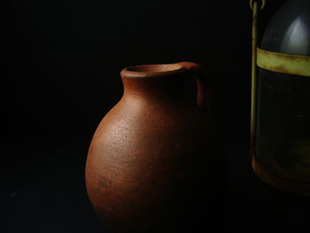 Close-up of bottle against black background