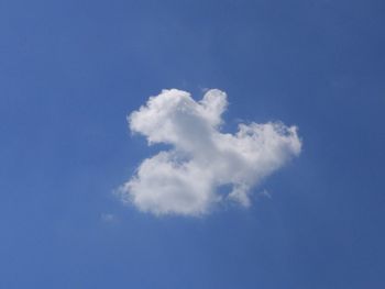 Low angle view of heart shape against blue sky