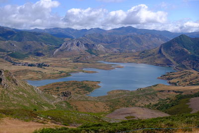 Scenic view of lake and mountains against sky