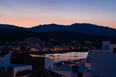 High angle shot of townscape against sky at sunset