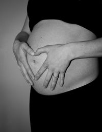 Close-up of human hand against black background