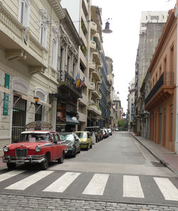 Vehicles on road along buildings