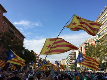 Low angle view of people against clear sky