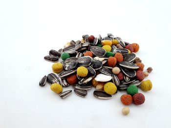 High angle view of candies against white background