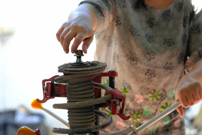 Close-up of boy playing with machine