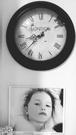 Portrait of young woman with text on wall