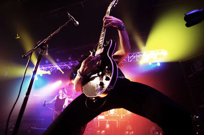 Low angle view of man performing at concert