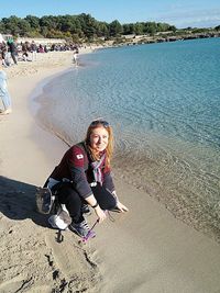 Portrait of a smiling young woman on beach